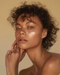 © ppalgangong - Close-up portrait of a young woman with curly hair and glowing skin
