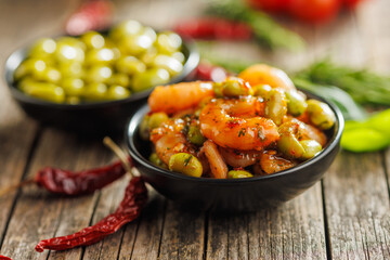 Wall Mural - Fresh salad with shrimps and edamame soybeans in bowl on wooden table.