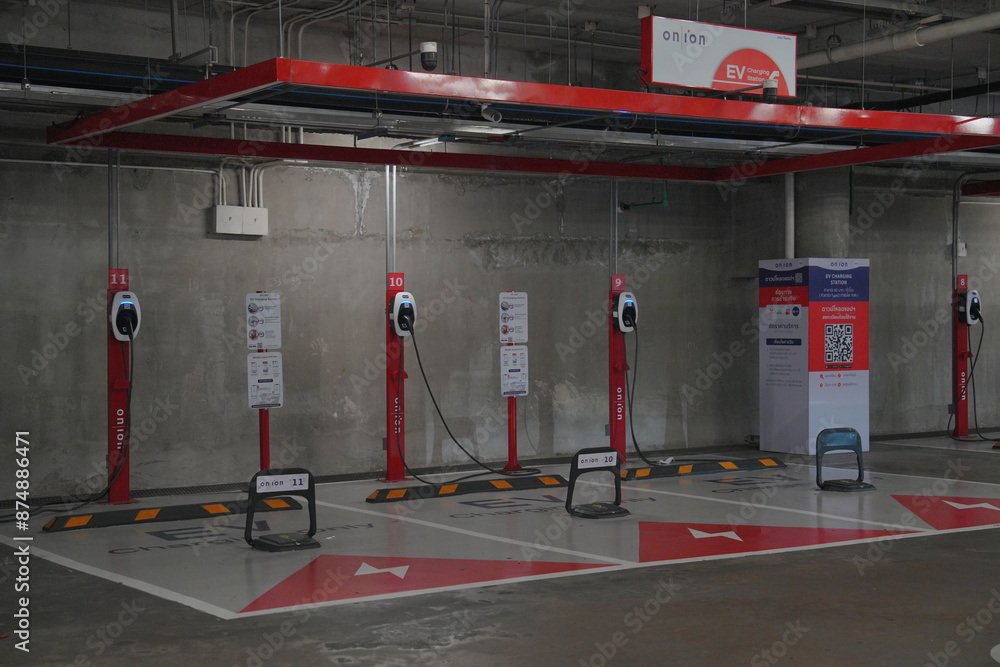 Red Echarging Indoor electric vehicle charging station with multiple red charging ...