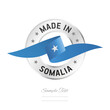 © simbos - Made in Somalia. Somalia flag ribbon with circle silver ring seal stamp icon. Somalia sign label vector isolated on white background