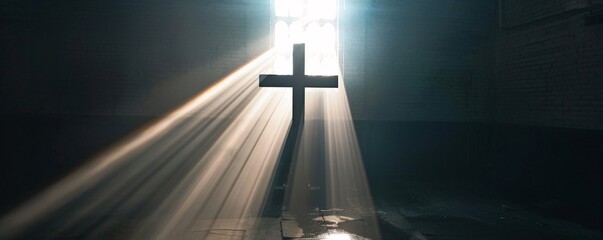 Wall Mural - Sunbeams shining through window of old church illuminating cross