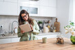 © Srdjan - Simple living. Young woman morning routine in domestic kitchen in her apartment with first coffee to wake up before she go to her work. Lifestyle of successful independent startup job owner.