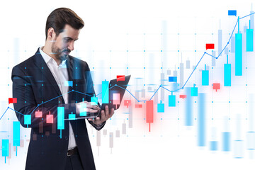 Fototapete - A businessman analyzing digital financial charts on a tablet, with graphical data overlay on white background, concept of market analysis
