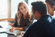 © ReeseArcurs/peopleimages.com - Businesswoman, meeting and paper with chart in office for feedback, check on growth stats for crypto market. Female broker, couple and graphs document for update on financial portfolio or investment