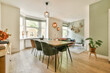 © ADDICTIVE STOCK - Modern dining room with stylish furnishings and natural light