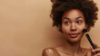 © Hanna - studio portrait of a black woman with a Cosmetics brush on a brown background beauty or cosmetic self care