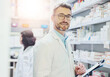© Tamani/peopleimages.com - Pharmacy, smile and portrait of man with clipboard for inventory, inspection or prescription. Medical, professional and mature pharmacist with checklist of pills for healthcare, supply or information