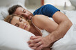 © Sanc/peopleimages.com - Tired, couple and sleeping with cuddle in bed for dreaming, commitment or peace in rest at home. Love, partner and woman with embrace of man in house for marriage, comfort or afternoon nap on weekend