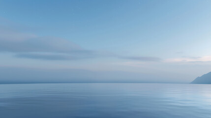 Wall Mural - A calm, clear blue ocean with a few clouds in the sky