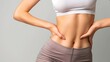 © Rungthiwa - Fit Woman's Toned Midsection in Activewear
