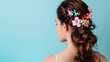 © Nazia - Young woman with beautiful hair clips on blue background ai generative