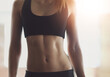 © ArcursPI/peopleimages.com - Fitness, woman or body of athlete with abs for exercise, health or strength workout in activewear for gym. Slim female person, sports bra or toned girl ready for training, stomach closeup or wellness