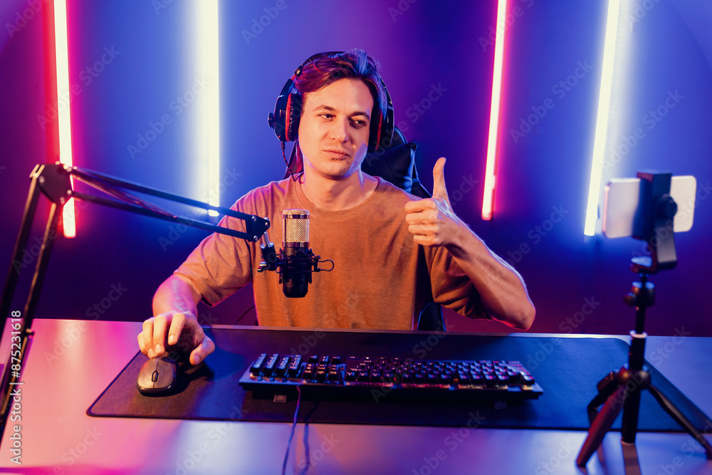 Host Streamer Host channel of gaming smart streamer playing online game, wearing ...