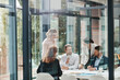 © ReeseArcurs/peopleimages.com - Window, business people or planning in meeting for paperwork, teamwork or collaboration together. Shareholders, investor or executive director speaking in discussion for feedback, review or project