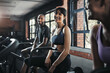 © peopleimages.com - People, happy and cycling in gym for workout or leg strength, cardio and muscle endurance for agility training. Recreation center, exercise bike and machine for cardiovascular, wellness and fitness.