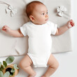 © Alena - Infant mockup, top front view. Infant in white body suit mock up. Baby laying in baby crib. Newborn, infant, toddler clothes, blank here your design template