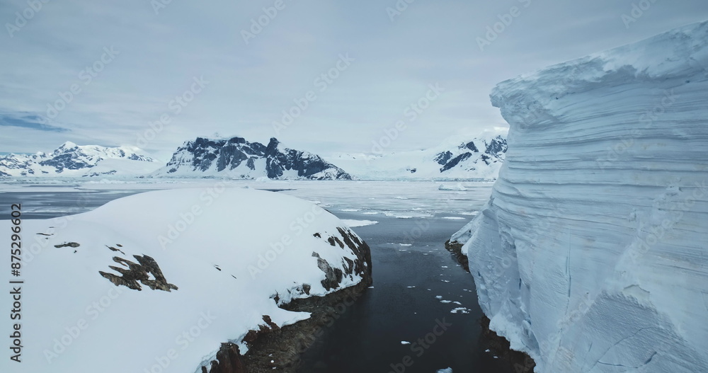 Antarctica winter landscape aerial view. Glacier towering above rocky ...