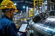 © ORG - Engineer holds tablet in food and beverage industry, production line inspection control, high pressure tank production line Production control work in industrial plants