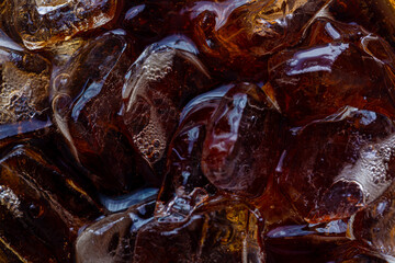 Wall Mural - Macro soft drink and ice drink texture,Cola and ice cubes macro texture. Cola drink with ice closeup background.