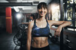© peopleimages.com - Girl, portrait and happy in gym for workout, bodybuilding and personal training for health or muscle strength. Female person, confident and proud for active living, fitness and cardio exercise.