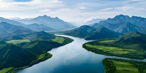 Wall Mural - Scenic aerial view of mountain range with river flowing through center. Concept Aerial Photography, Mountain Landscape, River View, Scenic Beauty