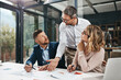 © peopleimages.com - Team, people and planning in office with documents for strategy or explain in collaboration meeting. Boardroom, business and project managers with report, feedback and results for company growth
