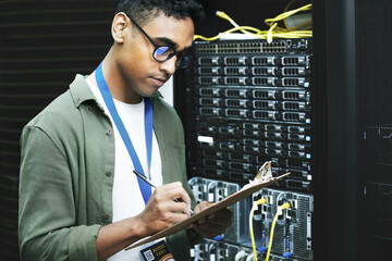 Poster - Data center, man and computer engineer with checklist, writing and notes as programmer. Male person, inspection and technology for hardware, security and server room for system update or maintenance