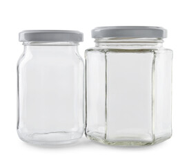 Wall Mural - Two empty glass jars isolated on white