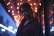 © AberrantRealities - a woman standing in front of lights in the rain