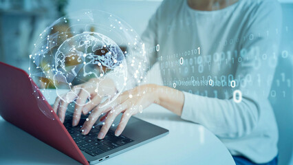 A woman using computer in office and digital communication network concept.