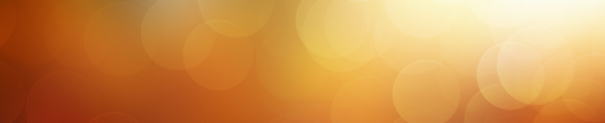 A bokeh blur background in yellow, gold, and orange. 
