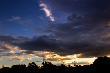 Wall Mural - beautiful sky and clouds at sunset over the city