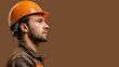 © Matcha_09 - Profile of engineer in hard hat and badge on brown backdrop