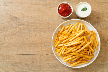 Wall Mural - French fries with sour cream and ketchup