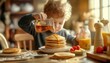 © nur - A little boy is pouring syrup on pancakes at the dinner table
