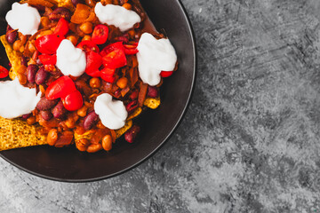 Wall Mural - healthy  bean nachos with tomato salsa and coconut yoghurt