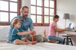 © sutthinon602 - Happy father and little son playing with toy blocks at home. Dad and son playing together