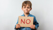 © ihalilyp - Young boy holding a sign with the word 'NO' written on it, isolated on a white background
