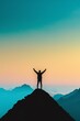 © Natalia - Silhouette of a person standing on a peak with arms raised, inspiration, achieving goals