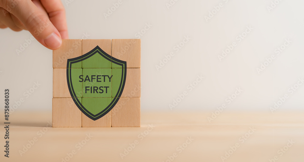 Safety first concept. The wooden cube block with text 