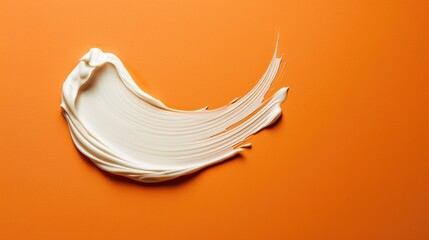 Poster - Creamy white cosmetic smear on orange background for skincare banner with copy space