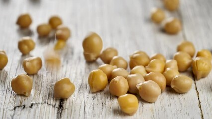 Canvas Print - chickpea falling on table