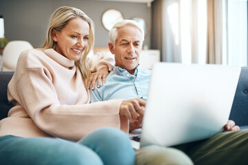 Home, relax and senior couple with laptop on sofa for online travel booking, information and decision. Man, woman and love with tech in living room for trip plan, web registration and reading reviews