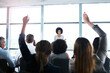 © AK Coop/peopleimages.com - Presentation, conference and woman with question from business people for discussion, meeting and speech. Entrepreneurship, audience and men and women ask in seminar, tradeshow and convention event