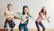© ReeseArcurs/peopleimages.com - Dance, fun and group of children in studio for hip hop rehearsal for concert show with music. Friends, rhythm and portrait of girls from Canada with groove for recital or performance at art school.