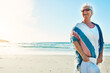 © ReeseArcurs/peopleimages.com - Ocean, travel and senior woman with smile for vacation, weekend holiday and adventure in Florida. Beach, elderly person and sunglasses for sunshine, peaceful and happiness in retirement by mockup