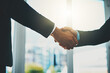 © Penn/peopleimages.com - Business people, meeting and shaking hands for introduction, support and advice at law firm consultation. Lawyer, attorney or advisor with handshake for client deal, merger and welcome to partnership