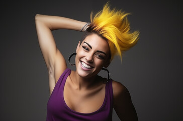 Wall Mural - A happy woman with bright yellow and purple hair smiling confidently, wearing a purple tank top against a dark background