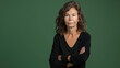 © OlScher - Woman With Arms Crossed in Front of Green Background