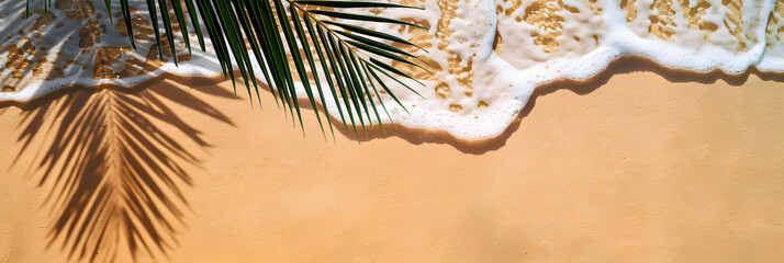 Wall Mural - idyllic empty sand beach with water wave and palm leaf shadow from above, beautiful sunny summer vacation background with copy space for text or product presentation, flat lay